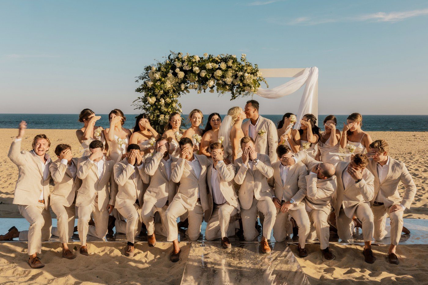 Wedding party walking on Cabo San Lucas beach — Ana Badillo Photography
