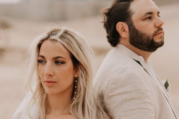 Couple spinning on beach with orange roses Cabo — Ana Badillo Photography